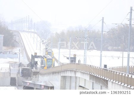 Utsunomiya Light Rail and heavy white snow 136393251