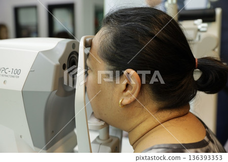 Phoropter for eye test, lenses glasses for eye check in optical store.  136393353