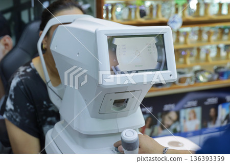 Phoropter for eye test, lenses glasses for eye check in optical store.  136393359