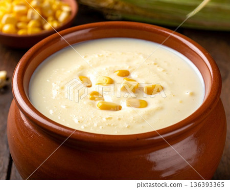Close up shot of creamy emasi sour milk mixed with ground maize in clay traditional pot. 136393365