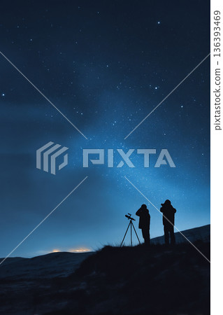 Astronomers observing the night sky with binoculars during a meteor shower in the desert. Astronomers observing the night sky with binoculars during a meteor shower in the desert. 136393469