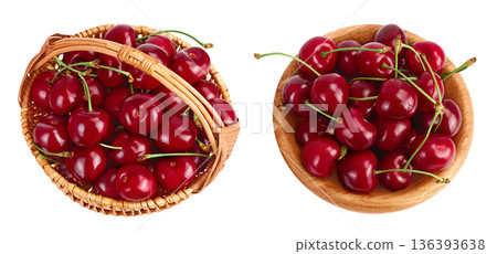 red sweet cherry in wicker basket and wooden bowl isolated on white background with full depth of field, Top view. Flat lay red sweet cherry in wicker basket and wooden bowl isolated on white background with full depth of field, Top view. Flat lay 136393638