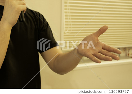 Male hand giving a speech Male hand giving a speech 136393737