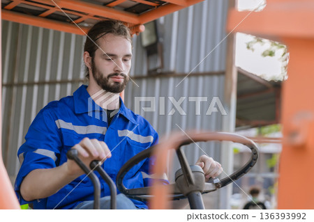 Man worker at forklift driver happy working in industry factory logistic ship. Man worker at forklift driver happy working in industry factory logistic ship. 136393992