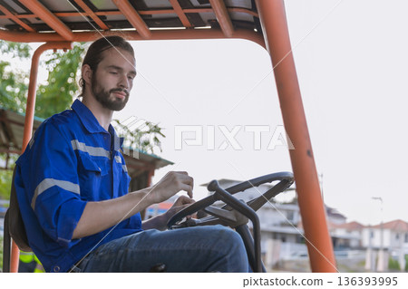 Man worker at forklift driver happy working in industry factory logistic ship. Man worker at forklift driver happy working in industry factory logistic ship. 136393995