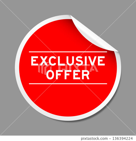 Red color peel sticker label with word exclusive offer on gray background 136394224