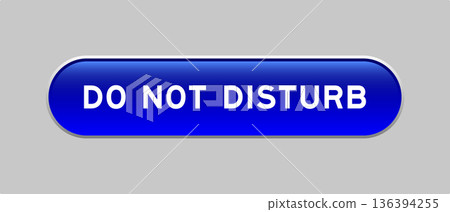 Blue color capsule shape button with word do not disturb on gray background 136394255