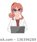 A woman in a white coat using a laptop 136394289