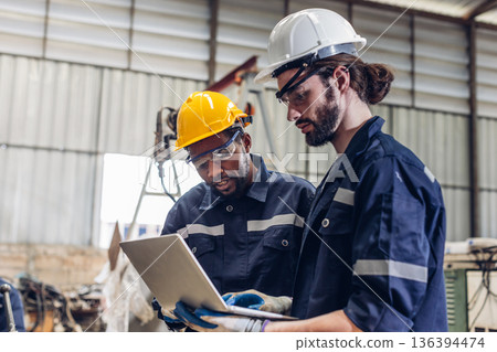 Workers Factory or Engineering work at factory site check up machine or products in site. Workers Factory or Engineering work at factory site check up machine or products in site. 136394474