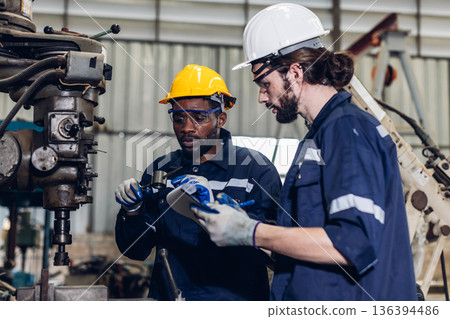 Workers Factory or Engineering work at factory site check up machine or products in site. Workers Factory or Engineering work at factory site check up machine or products in site. 136394486