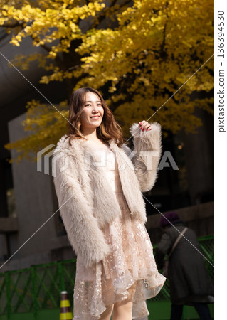 Woman playing in autumn park 136394530