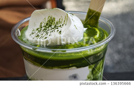 Iced matcha latte is a refreshing drink. 136395666