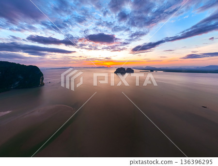 Aerial view sunset sky,Nature beautiful Light Sunset or sunrise over sea,Colorful scenery sunset Panorama Sky with Amazing clouds and waves in the ocean golden light cloud background 136396295