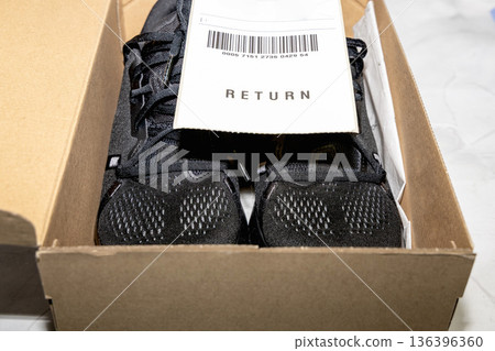 Online order return package with receipt document 136396360