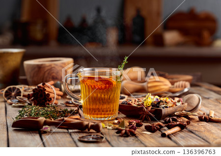 Herbal tea with thyme and dried orange slice. Herbal tea with thyme and dried orange slice. 136396763
