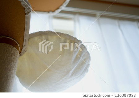 Close-up of a cat tower bed with curtains in the background Close-up of a cat tower bed with curtains in the background 136397058