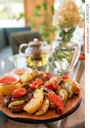 Grilled Sausages with Vegetables and Dipping Sauces Grilled Sausages with Vegetables and Dipping Sauces 136397324