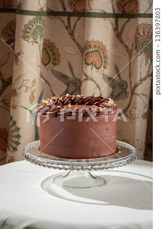 Chocolate cake with creamy frosting and nuts Chocolate cake with creamy frosting and nuts 136397803
