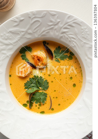 Creamy seafood soup with shrimp and herbs 136397804