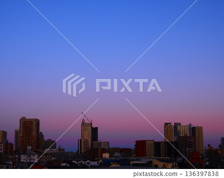 Venus Belt enveloping skyscrapers at dusk 136397838