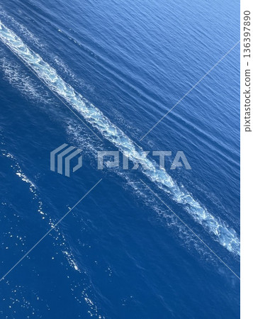Water stream after speed boat crystal clear sea water, aerial photo. Sea Background. Wallpaper. 136397890