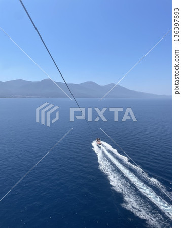 Aerial view of speed boat in motion. Water transportation and summer leisure time activity. 136397893