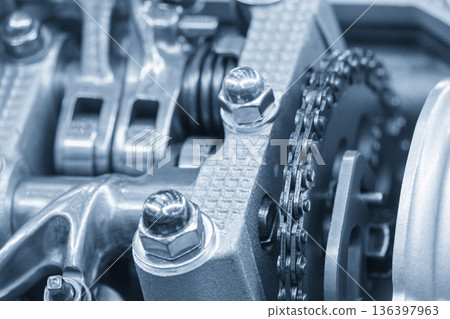 Close Up of Automotive Cylinder Head Parts in Light Blue Industrial Scene Close Up of Automotive Cylinder Head Parts in Light Blue Industrial Scene 136397963
