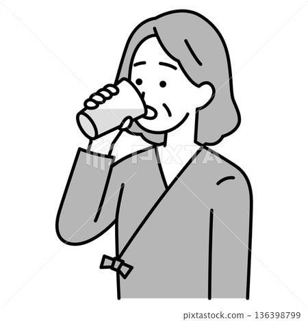 Elderly woman in examination clothes drinking barium Elderly woman in examination clothes drinking barium 136398799