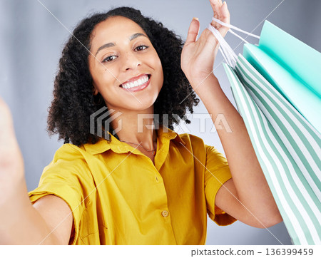 Shopping bag, selfie and woman in portrait for discount, sale and happy on white background. Retail, face and fashion influencer, african person or customer with profile picture photography in studio 136399459