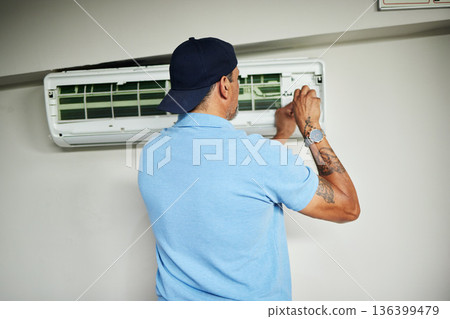 Machine, ac repair and air conditioner with man and screwdriver for maintenance, ventilation or power. Engineering, electricity and inspection with technician and tools for electrician and contractor 136399479