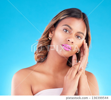 Woman, portrait and beauty with pink lipstick, skincare and makeup with cosmetics on blue background. Color, bold and wellness with self care, skin glow and cosmetology, female model in a studio Woman, portrait and beauty with pink lipstick, skincare and makeup with cosmetics on blue background. Color, bold and wellness with self care, skin glow and cosmetology, female model in a studio 136399544