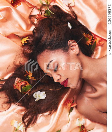 Hair, silk and flowers by a woman with beauty and cosmetic fashion fabric for wellness, glow and skincare. Aesthetic, above and calm young female person with luxury, natural or elegant backdrop Hair, silk and flowers by a woman with beauty and cosmetic fashion fabric for wellness, glow and skincare. Aesthetic, above and calm young female person with luxury, natural or elegant backdrop 136399578