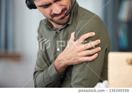 Call center man, shoulder pain and muscle in office, communication expert or consultant with burnout. Young telemarketing agent, crm and stress injury with accident, problem or fatigue in workplace Call center man, shoulder pain and muscle in office, communication expert or consultant with burnout. Young telemarketing agent, crm and stress injury with accident, problem or fatigue in workplace 136399599