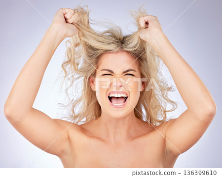 Messy hair, woman shout and frustrated with beauty, problem and salon hairstyle disaster on white background. Haircare stress, female model screaming and angry, treatment fail and damage in studio 136399610