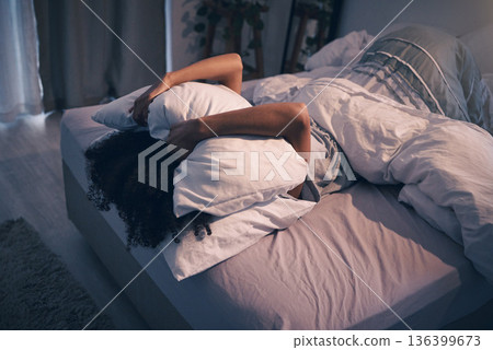 Bedroom, insomnia and woman with pillow on face, tired and frustrated with stress, nightmare or dream. Fatigue, sleep problem and exhausted girl in bed with fear, scared at night and crisis in home. 136399673