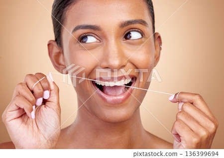 Woman, dental floss and studio for thinking, smile and cleaning for teeth whitening by brown background. Girl, model or happy for dentistry product, ideas or self care for cosmetic, beauty or health 136399694