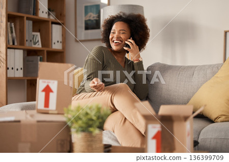 Phone call, boxes and woman in new home, real estate and property investment with online communication. Conversation, talking and happy african person for moving services in living room, sofa or home Phone call, boxes and woman in new home, real estate and property investment with online communication. Conversation, talking and happy african person for moving services in living room, sofa or home 136399709