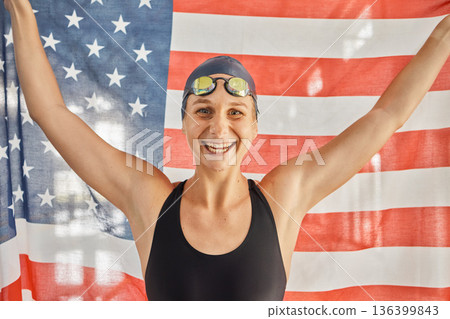 Woman, sport and flag for USA in portrait for winning, goals and pride for swimming games. Girl, swimmer or athlete with smile on face for contest, race or happy for fitness, health or United States Woman, sport and flag for USA in portrait for winning, goals and pride for swimming games. Girl, swimmer or athlete with smile on face for contest, race or happy for fitness, health or United States 136399843
