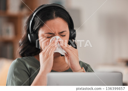 Woman, sick and blowing nose in work from home office for allergies, cold virus and flu risk of telemarketing consultant. Female virtual assistant, sales agent or sneeze at laptop for allergy problem Woman, sick and blowing nose in work from home office for allergies, cold virus and flu risk of telemarketing consultant. Female virtual assistant, sales agent or sneeze at laptop for allergy problem 136399857