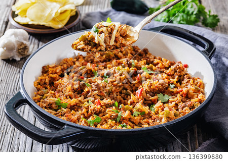 Texas hash of beef pepper onion tomato and rice 136399880