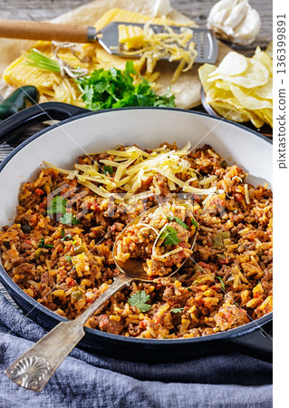 Texas hash of beef pepper onion tomato and rice 136399891
