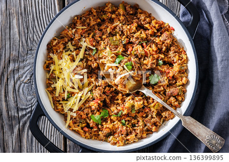 Texas hash of beef pepper onion tomato and rice 136399895