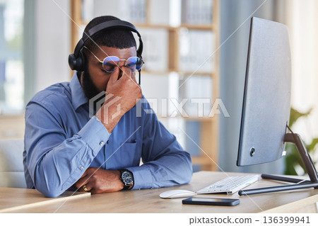 Call center, man and headache, pain or stress for communication mistake, error and sales crisis on computer. Agent, consultant or african person in glasses and computer with eye care in telemarketing 136399941