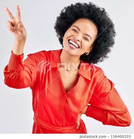 Support, peace sign and portrait of a black woman on a studio background with an emoji. Smile, funny model and an African girl or employee with a hand gesture isolated on a backdrop for comedy Support, peace sign and portrait of a black woman on a studio background with an emoji. Smile, funny model and an African girl or employee with a hand gesture isolated on a backdrop for comedy 136400103