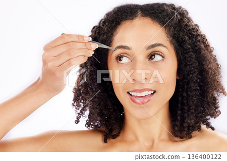 Woman, beauty and face with tweezers for eyebrow in studio, white background and aesthetic change. Female model, epilation tools and hair removal for grooming brows, facial skincare and cosmetics 136400122