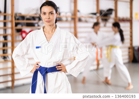 Young girl wearing kimono standing in sports hall 136400193