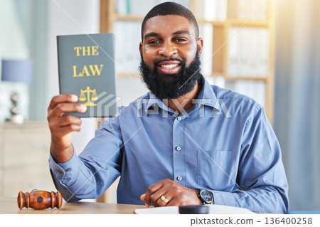 Happy, man and portrait with a book on the law, rules or research on legal constitution, regulation or policy from government. African businessman, lawyer or attorney with knowledge of justice Happy, man and portrait with a book on the law, rules or research on legal constitution, regulation or policy from government. African businessman, lawyer or attorney with knowledge of justice 136400258
