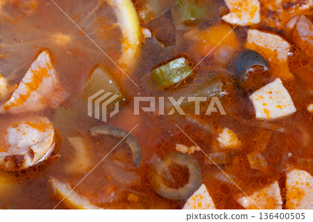 Rich spicy soup, Flavorful stew with smoked ingredients, Hearty smoky broth garnished with citrus and herbs, Deeply flavored paprika broth with smoked meats and bright citrus Rich spicy soup, Flavorful stew with smoked ingredients, Hearty smoky broth garnished with citrus and herbs, Deeply flavored paprika broth with smoked meats and bright citrus 136400505