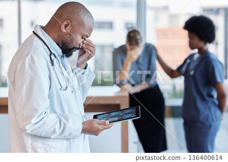 Surgeon, man and medical error or frustrated at hospital with tablet or bad news for patient. Mistake, doctor and technology with results or scan with error by healthcare worker with crises or xrray. Surgeon, man and medical error or frustrated at hospital with tablet or bad news for patient. Mistake, doctor and technology with results or scan with error by healthcare worker with crises or xrray. 136400614