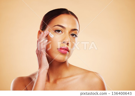 Skincare, portrait or woman with face cream or sunscreen product in grooming routine with cosmetics. Dermatology, studio background or beauty model applying natural facial creme lotion moisturizer 136400643